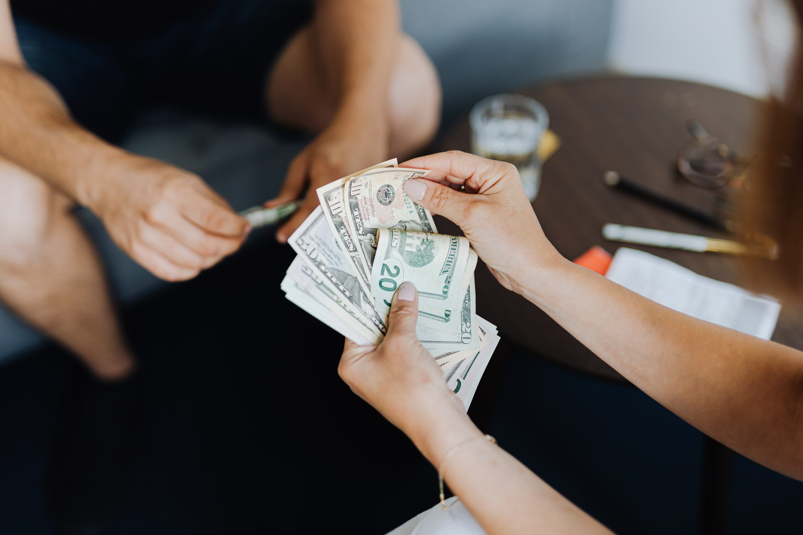 Hands counting dollar bills